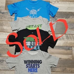 Three nike tees and 1 quick silver tee boys large